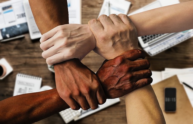 cooperate with
